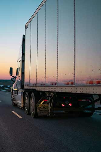 Truck driver driving to social security disability lawyers office to receive SSDI benefits.